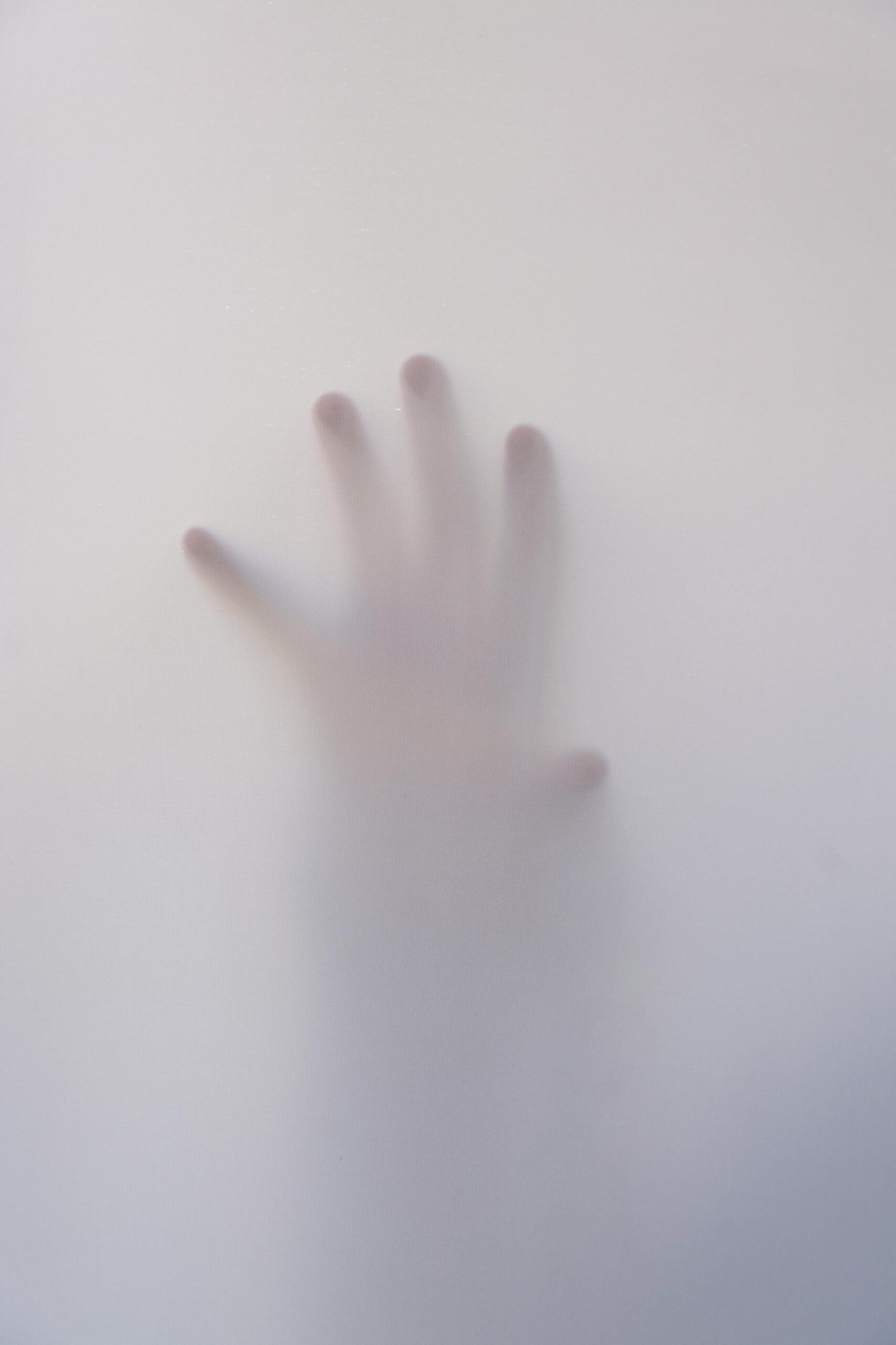 hand reaching through fog