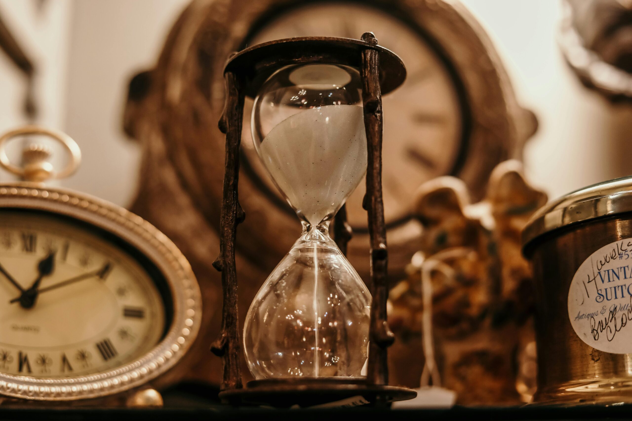 hour glass and antique clocks